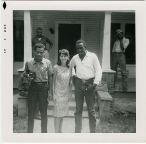Charles T. Scales, Gloria Xifaras Clark, and Wayne Yancey (l. to r.) on steps of Freedom House