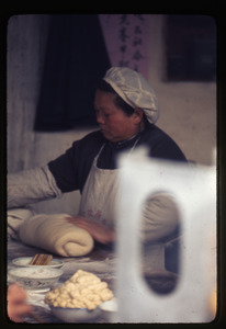 Woman rolling dough