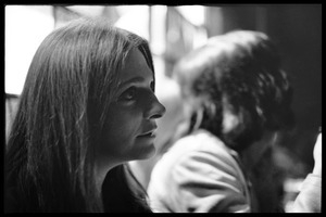 Judy Collins: portrait in profile, seated at a lunch table
