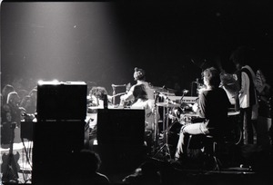 Santana concert at the Springfield Civic Center: view of band from behind bank of audio equipment