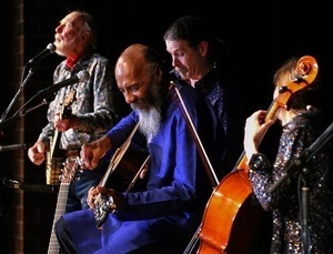 Pete Seeger (banjo), Richie Havens (guitar), Walter Parks, and Stephanie Winters (cello) performing at the Clearwater Festival