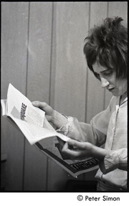 Rod Stewart reading a magazine