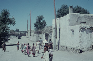 Children walking down a street