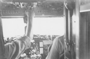 Pilots inside the cockpit of a Douglas C-47 at Lowry ROTC summer camp