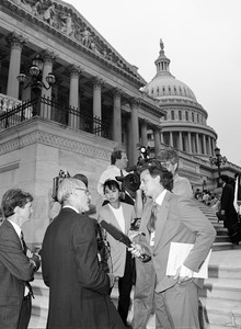 Congressman John W. Olver (left) being interviewed by a reporter on the steps of the United States Capitol building