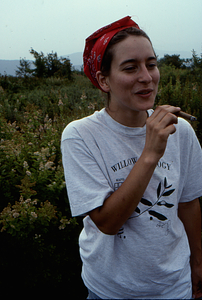 Last day of Permanent Plot Survey III. Amy Smith (Class of 1997) enjoys cigar atop Jim Smith Hill.