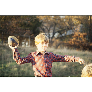 Boy throwing a football