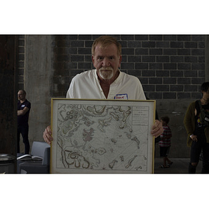 Frank Biagiotti holding Boston map