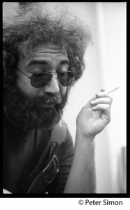 Jerry Garcia: portrait close-up, smoking a cigarette