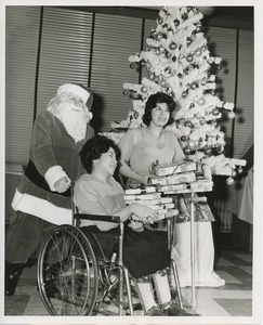Santa Claus giving gifts to international patients