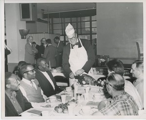 Dave Garroway carving turkey at Thanksgiving