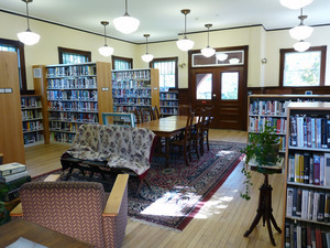 Buckland Public Library: interior view of casual seating area and bookcases