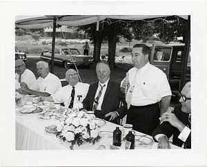 John F. Collins attending an outdoor luncheon event