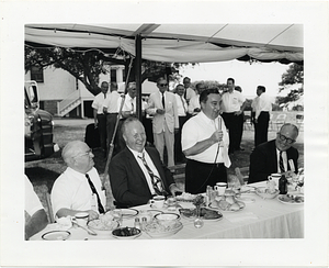 Mayor John F. Collins attending an outdoor luncheon