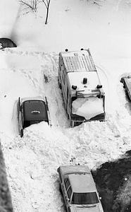 Boston Police vehicles buried in snow