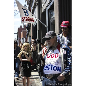 Man wearing "God Bless Boston" t-shirt