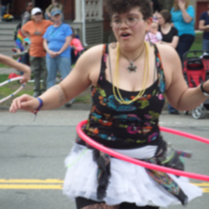 A hula hooper at Pride