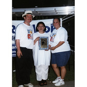 David Cortiella, Betty V. Rivera, and Yolanda Tubens pose for a photograph at Festival Betances.
