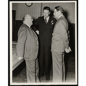 From left to right, J. Willard Hayden, Henry Cabot Lodge, Jr., and Maurice J. Tobin, conversing at the dedication and cornerstone laying ceremony for the Charles Hayden Memorial Clubhouse in South Boston
