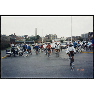 Riders exit a parking lot during the Charlestown Bike Race