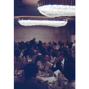 Crowded room of diners at a formal banquet event