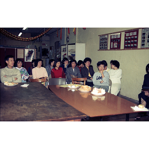 Audience and refreshments at a meeting between Mexican workers and the Chinese Progressive Association