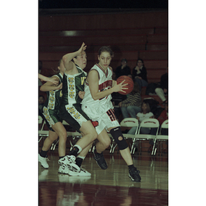 Northeastern women's basketball player with the ball