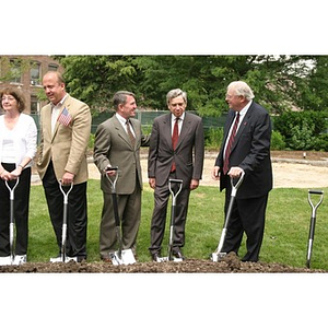 President Freeland and four others hold shovels for the groundbreaking of the Veterans Memorial