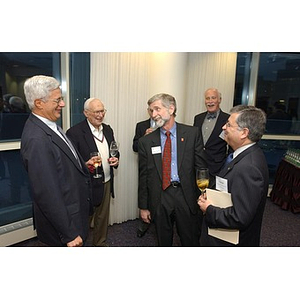 Two men converse at The National Council Dinner