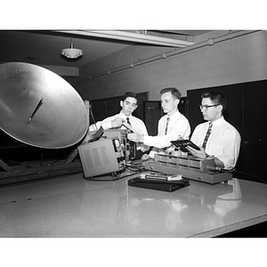 Electrical Engineering students work with a satellite dish