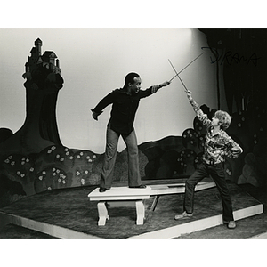 Two students sword fighting in play rehearsal