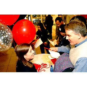 Students, staff, and faculty at an event in Snell Library lobby