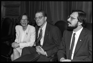 Russell A. Hulse (right) and Joseph H. Taylor seated with unidentified woman at a reception with Massachusetts state legislators honoring their Nobel Prize in Physics