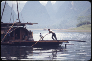 People poling boat