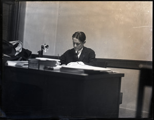 Donald W. Barnes, seated at a desk