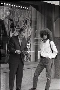 Middle-aged man in suit looking at Free Spirit Press magazine