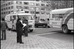 Free Spirit Press bus and Channel 5 news van parked during interview by Channel 5 news