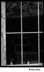 Raymond Mungo reflected in a barn window: Packer Corners commune