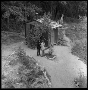 Man and a woman talking by the outhouse, Brotherhood of the Spirit dormitory, Warwick, Mass.