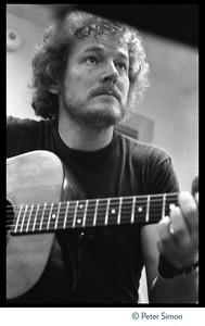 Gordon Lightfoot: half-length portrait, playing guitar