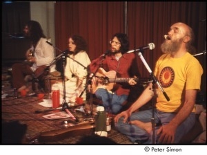 Ram Dass on stage with Amazing Grace