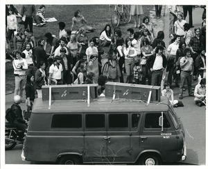 Board of Trustees fee increase demonstration: protestors with Campus Center Media van