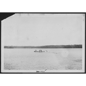 View of canoes on lake at unidentified YMCA camp