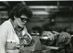 Unidentified woman operating machinery