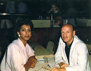 A Photograph of Monique Marlow and Other Sitting in a Restaurant