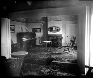 Interior of a parlor in an unidentified house (possibly the Lake Pleasant Hotel)