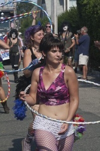 Parade marchers wielding hula hoops : Provincetown Carnival parade