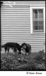 Harry Saxman with commune dogs (cat in background), Montague Farm commune