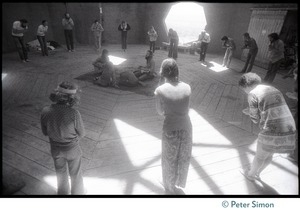 Sufi dancers bowing to one another inside the dome at the Lama Foundation