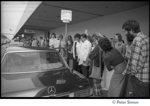 Devotees gathering around Swami Muktananda's car outside Los Angeles airport